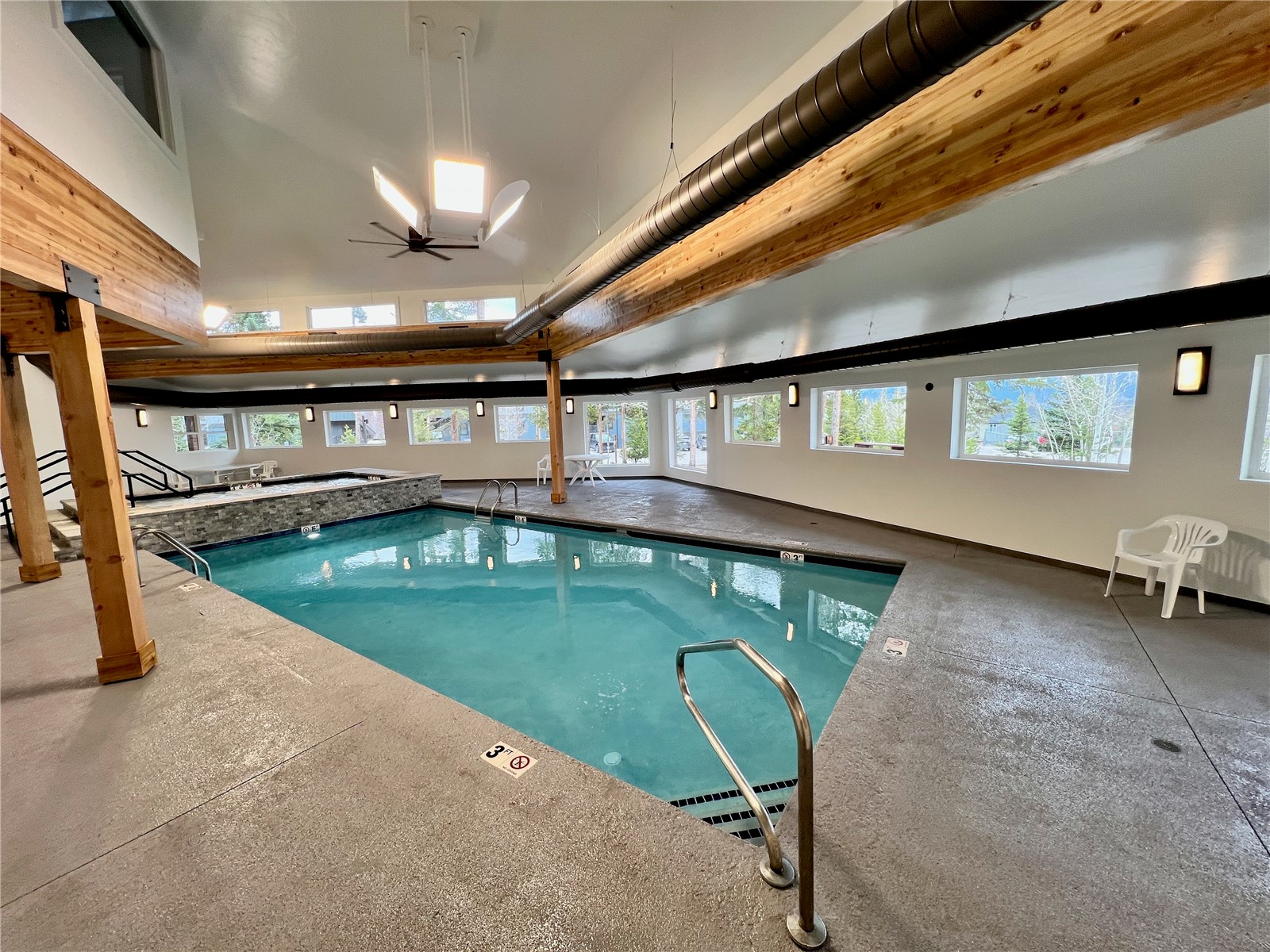 89410 Ryan Gulch Road, Unit 104 Silverthorne, CO 80498 - Photo 20 of 31 a view of a swimming pool with a yard