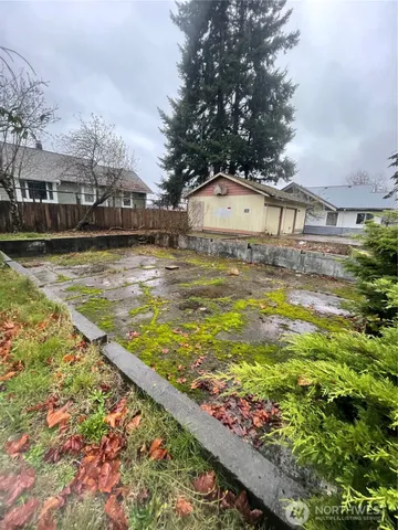 a view of a swimming pool with a house