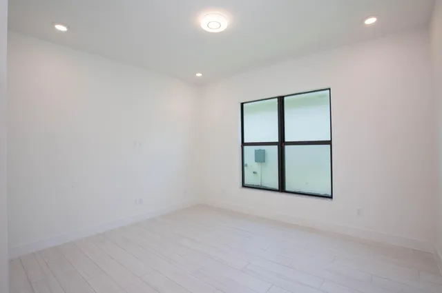 an aerial view of a house with a swimming pool yard and outdoor seating