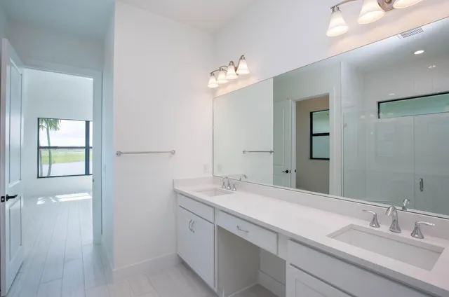 a utility room with sink dryer and washer