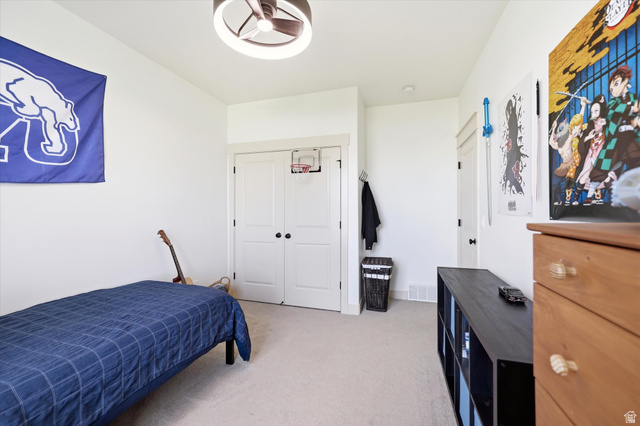 283 North 500 West Mapleton, UT 84664 - Photo 52 of 102 Bedroom with light colored carpet and a closet.