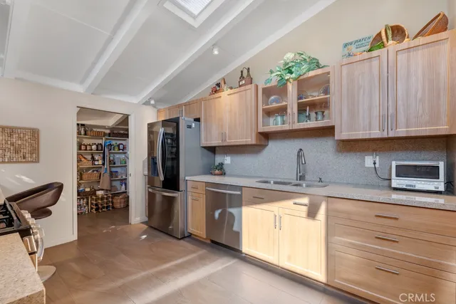 a kitchen with stainless steel appliances granite countertop a stove and a sink