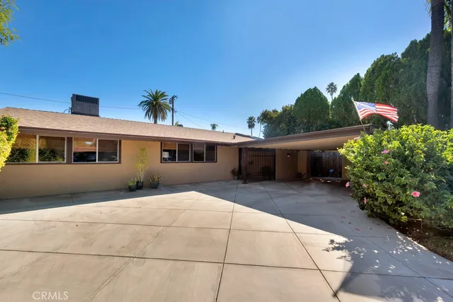 a front view of house with an outdoor space