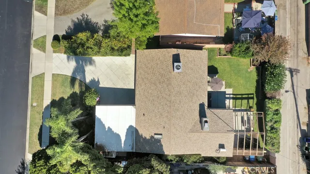 an aerial view of multiple houses with yard