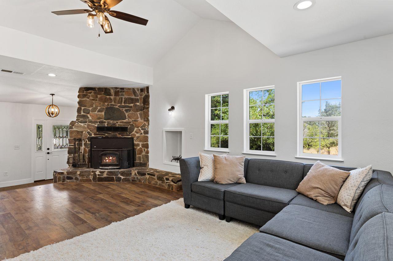 3266 Campbell Circle Rescue, CA 95672 - Photo 13 of 44 Amazing statement fireplace with lots of windows