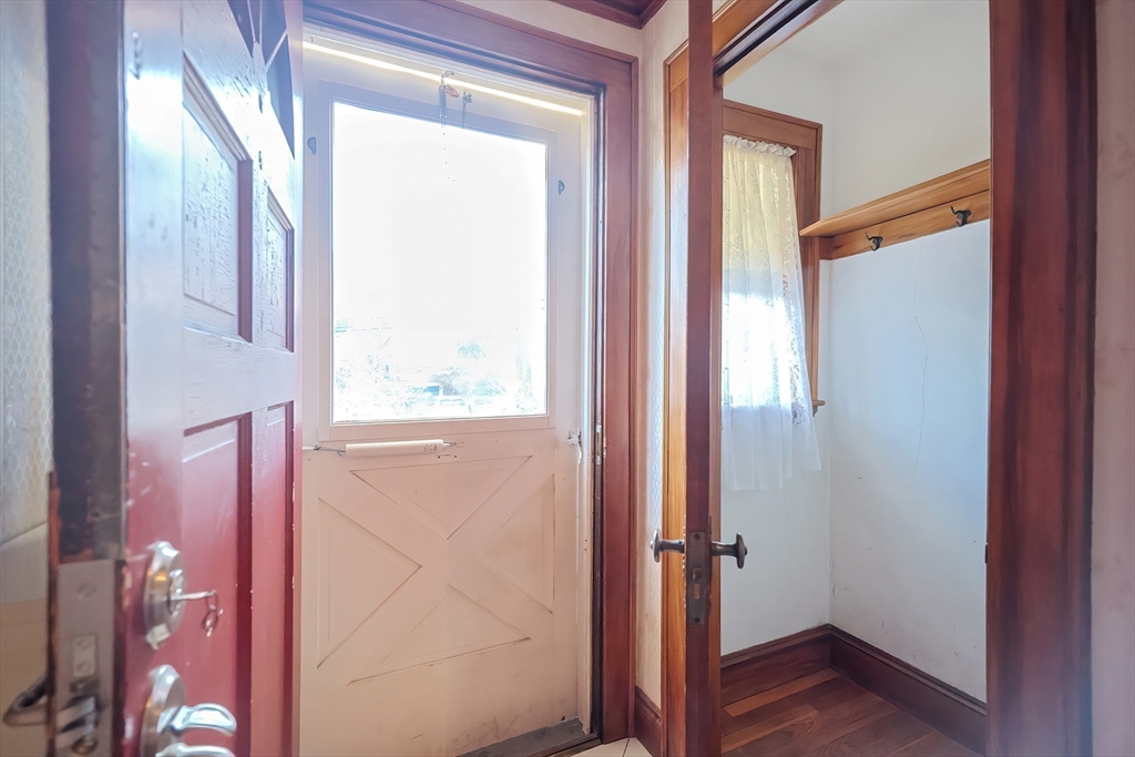 249 Russett Road Brookline, MA 02467 - Photo 4 of 42 a view of front door with wooden floor