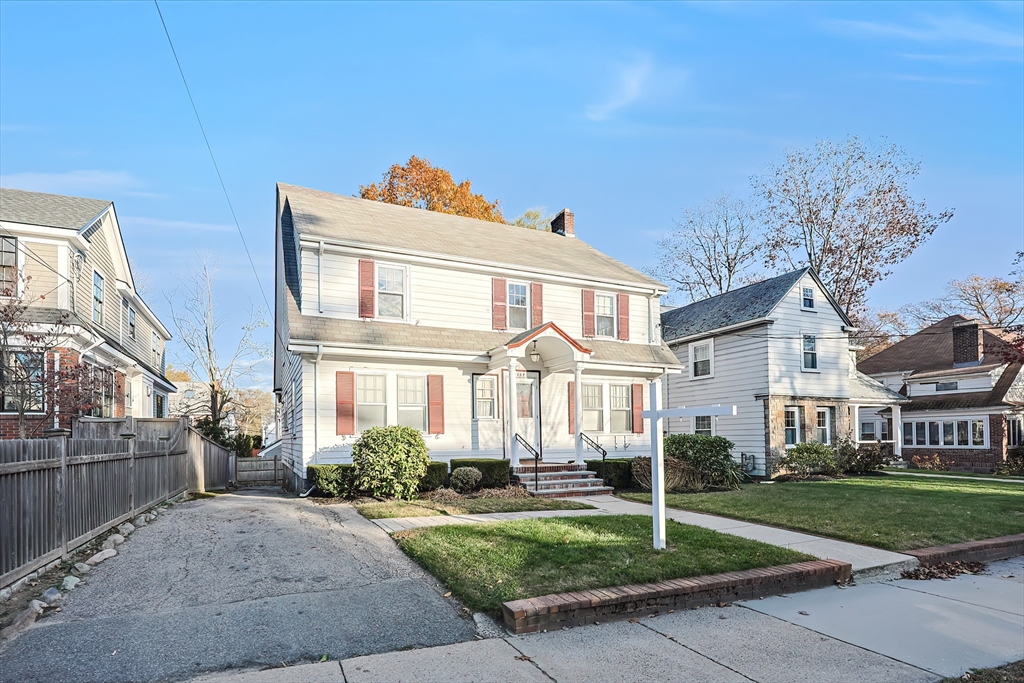 249 Russett Road Brookline, MA 02467 - Photo 42 of 42 a front view of a house with a yard