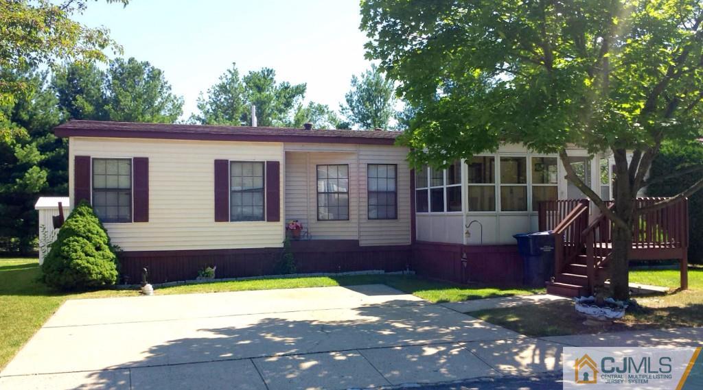 15 Longfellow Road, Unit 15 North Brunswick, NJ 08902 - Photo 1 of 12 a front view of a house with a yard
