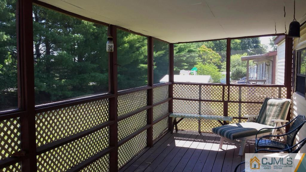 15 Longfellow Road, Unit 15 North Brunswick, NJ 08902 - Photo 10 of 12 a view of a balcony with couch
