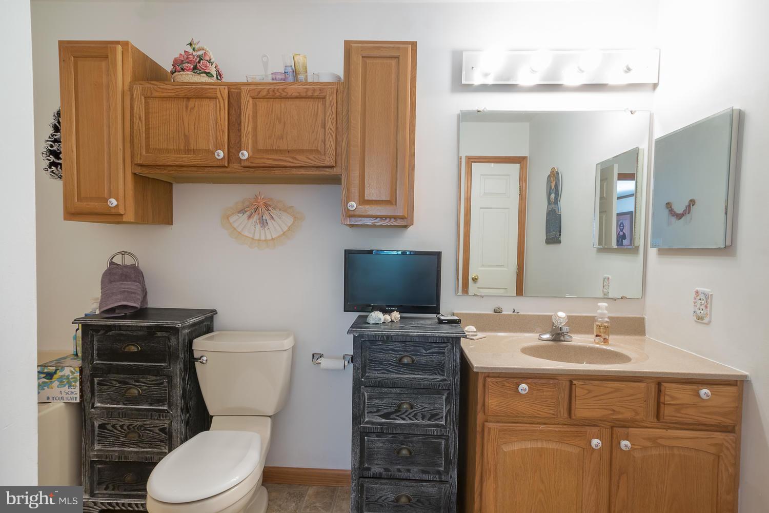 3610 Galloway Road Baltimore, MD 21220 - Photo 14 of 30 Single Vanity w/Oak Cabinets, Large Linen Closet