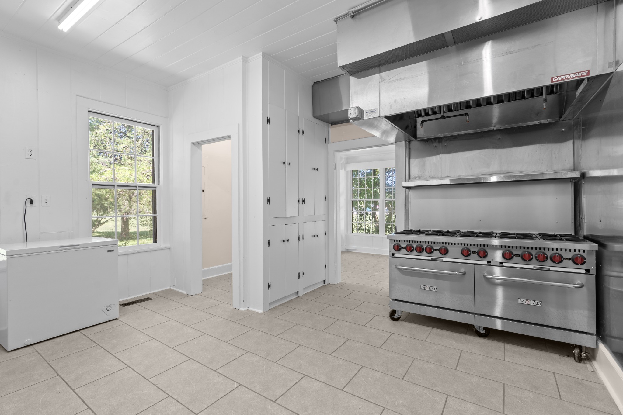 219 Old Mill Road Winchester, TN 37398 - Photo 13 of 23 a kitchen with cabinets and a stove top oven