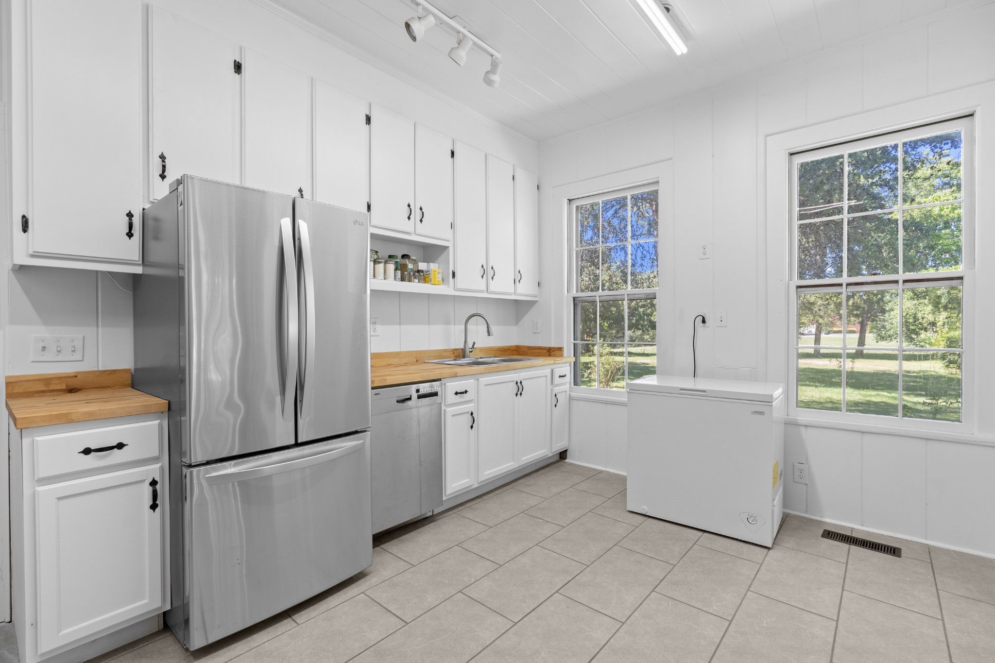 219 Old Mill Road Winchester, TN 37398 - Photo 14 of 23 a kitchen with white cabinets and white appliances