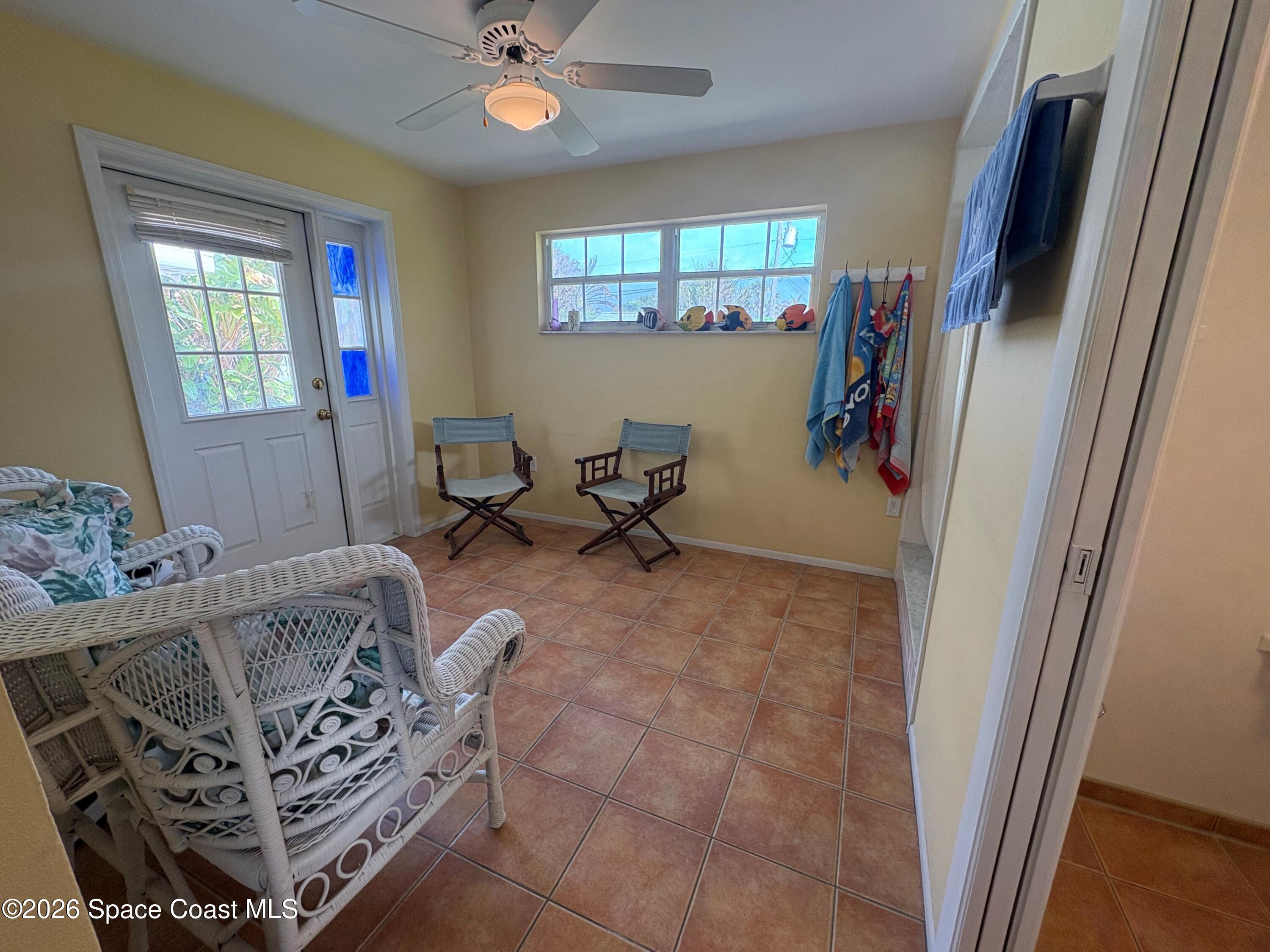 212 Surf Road Melbourne Beach, FL 32951 - Photo 4 of 14 a living room with furniture and a window