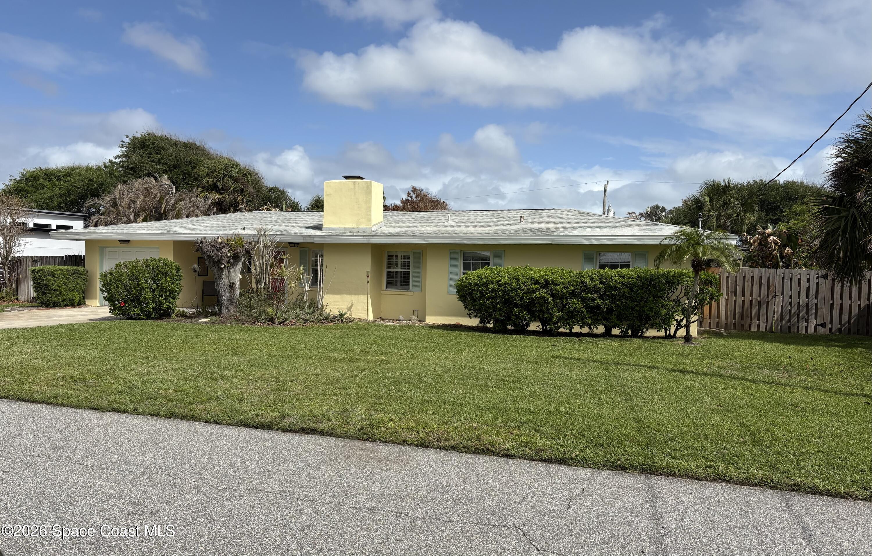 212 Surf Road Melbourne Beach, FL 32951 - Photo 10 of 14 a view of a house with backyard and a garden