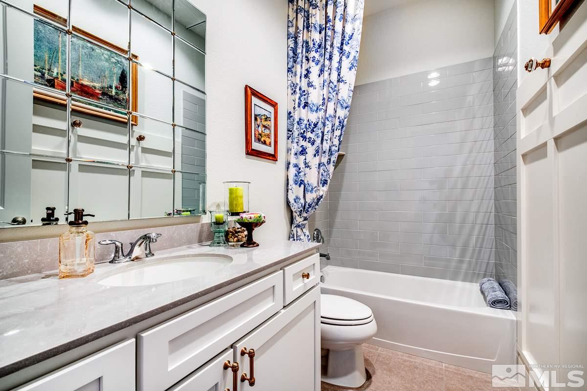 2906 Miramis Court Reno, NV 89521 - Photo 21 of 25 a bathroom with a sink a toilet and shower