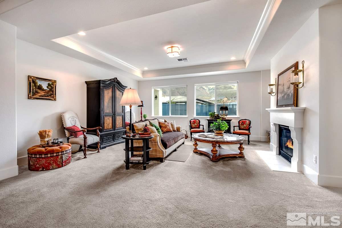 2906 Miramis Court Reno, NV 89521 - Photo 5 of 25 a living room with furniture and a fireplace