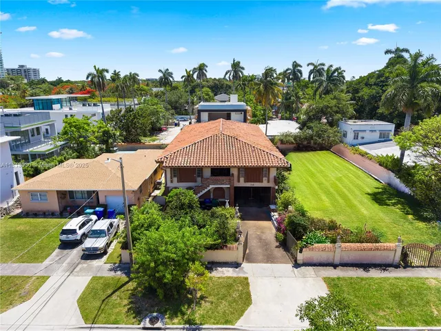 a view of a patio with furniture and a yard