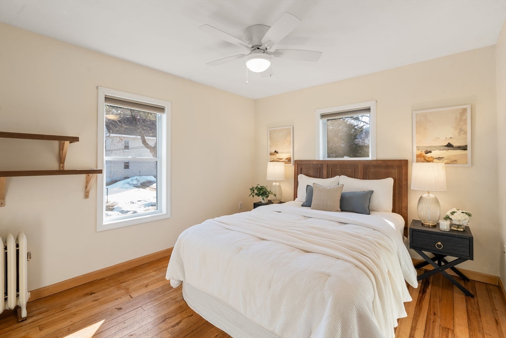38 Fairfield Street Maynard, MA 01754 - Photo 19 of 42 a bed room with a bed and a painting on the wall