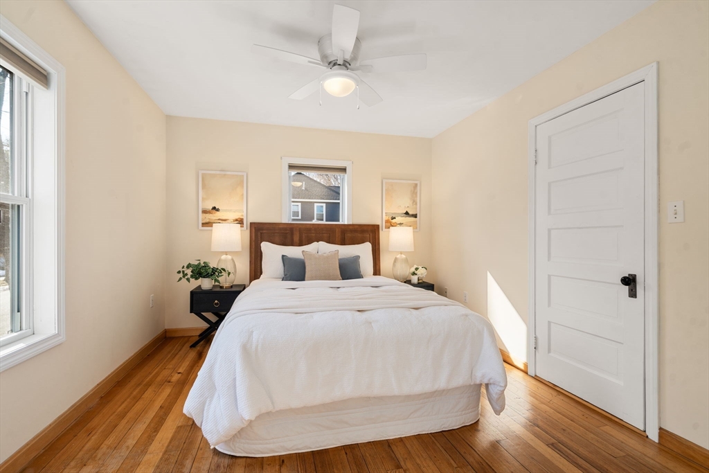 38 Fairfield Street Maynard, MA 01754 - Photo 20 of 42 a bedroom with a bed and wooden floor