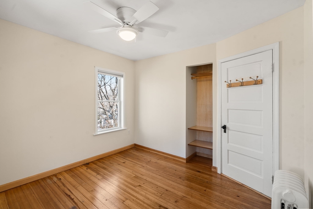 38 Fairfield Street Maynard, MA 01754 - Photo 26 of 42 an empty room with wooden floor and closet