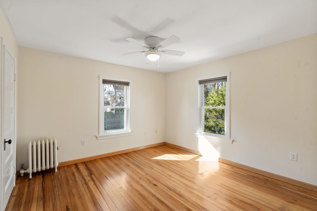 38 Fairfield Street Maynard, MA 01754 - Photo 27 of 42 a view of an empty room with wooden floor and a window