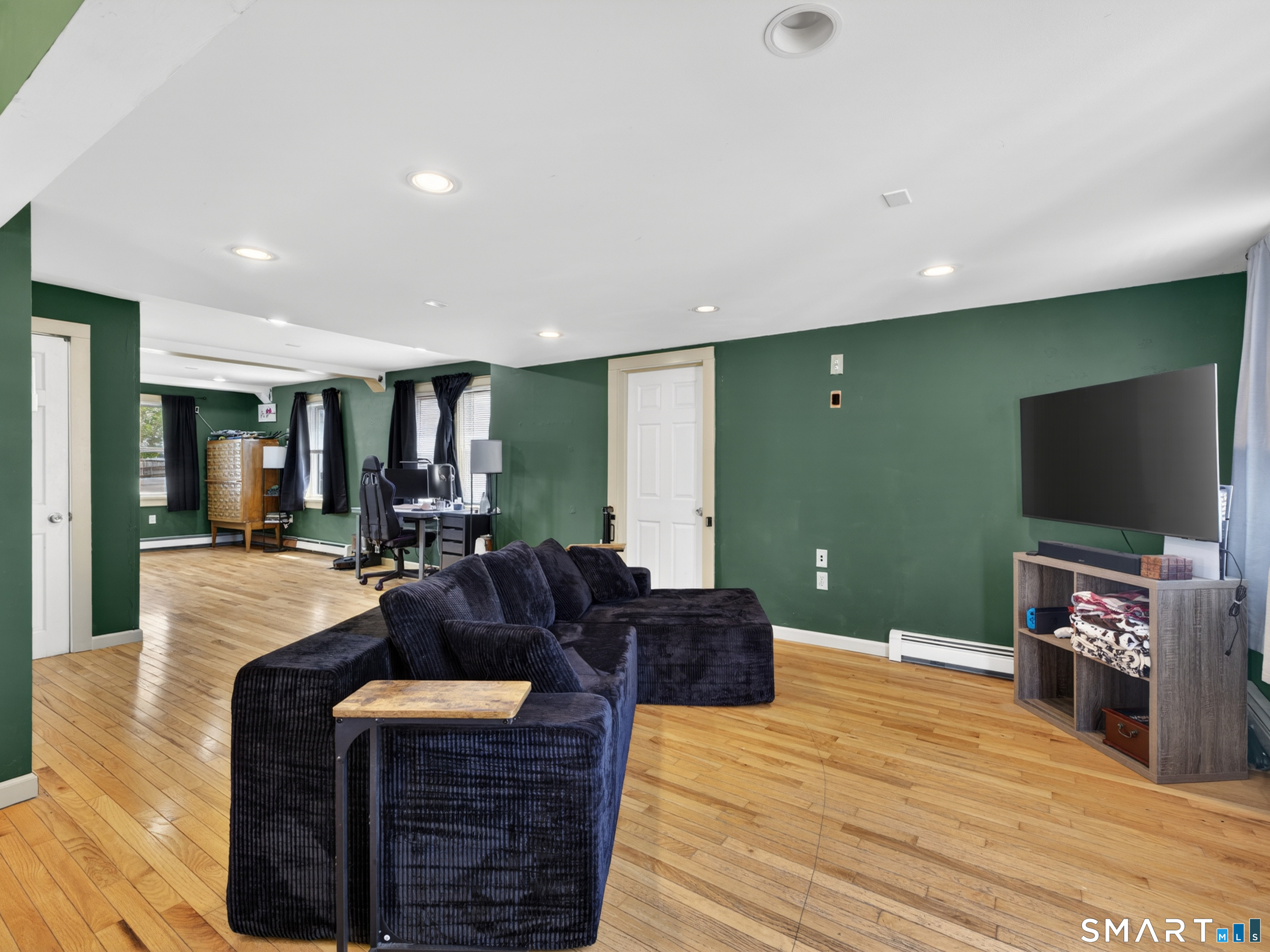 13 Oak Street Groton, CT 06340 - Photo 9 of 38 a living room with fireplace furniture and a flat screen tv