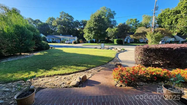 a view of a swimming pool with a yard