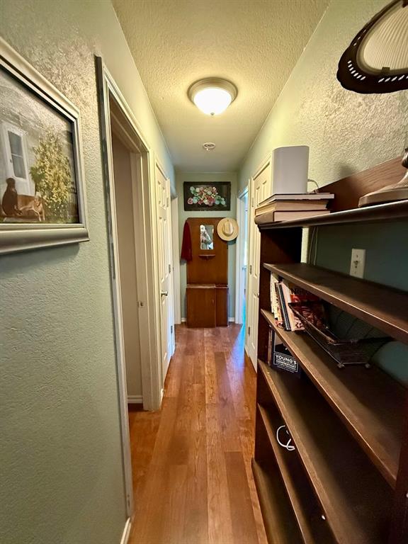 2001 Wood Trail Azle, TX 76020 - Photo 19 of 30 a hallway with chairs and wooden floor