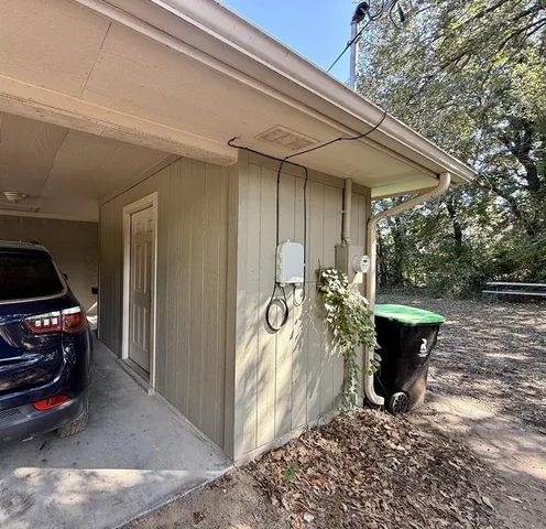 a view of a patio with table and chairs and potted plants