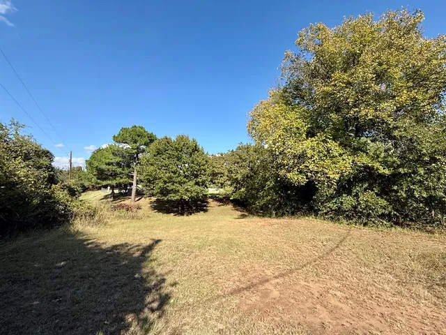 a view of a yard covered in snow