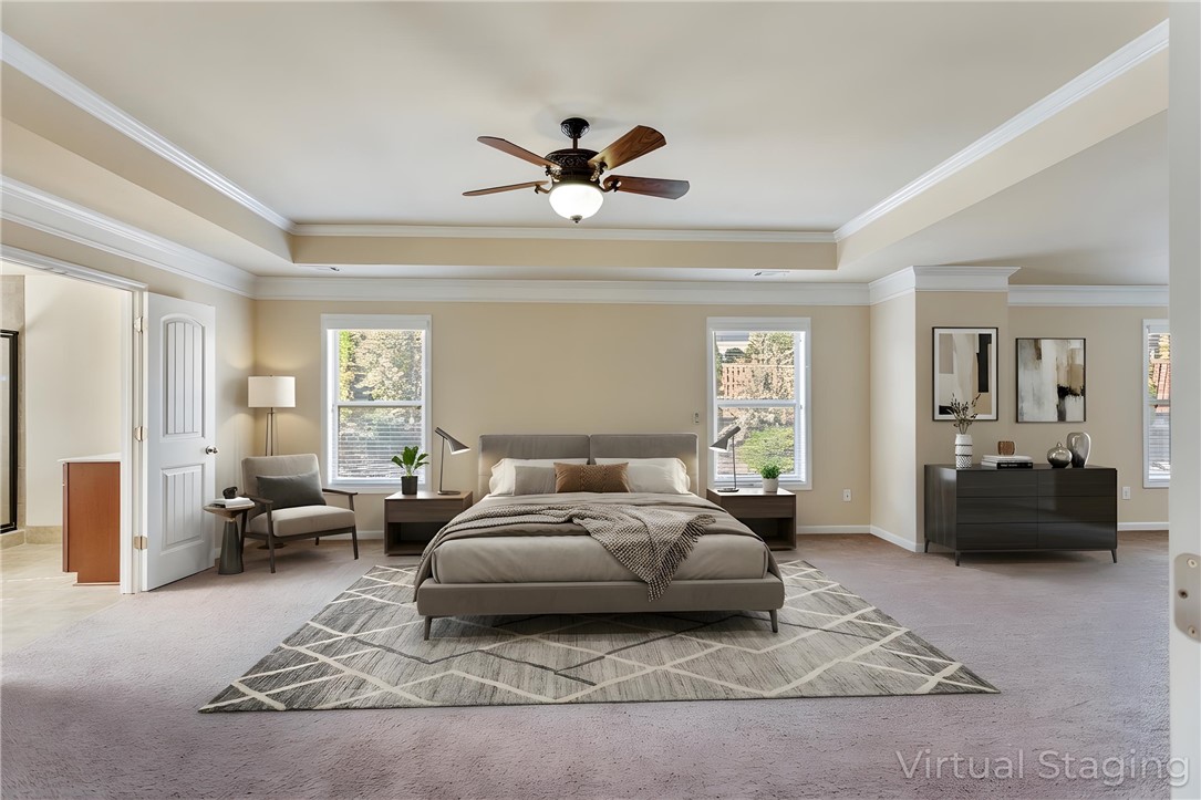 1005 Winmar Drive Anderson, SC 29621 - Photo 8 of 50 This spacious primary bedroom features a tray ceiling and crown molding for elegant design.