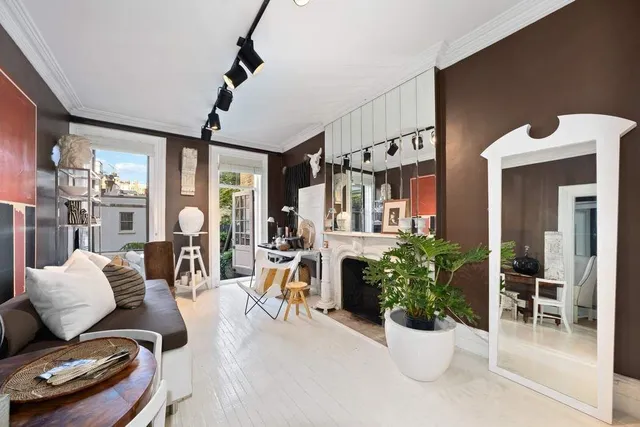 a living room with furniture and a fireplace