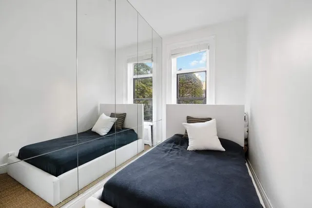 a living room with furniture and potted plant