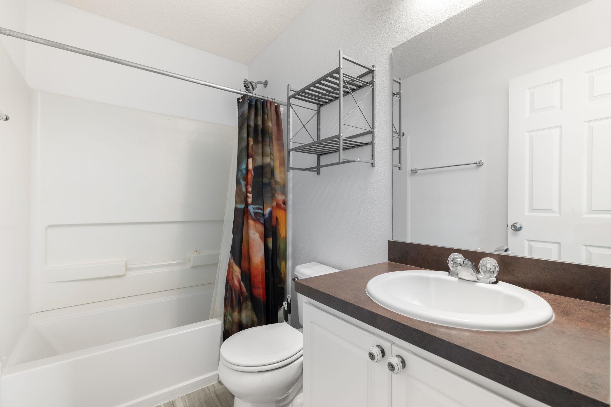 128 Islander Circle St. Augustine, FL 32080 - Photo 16 of 24 a bathroom with a sink toilet and shower