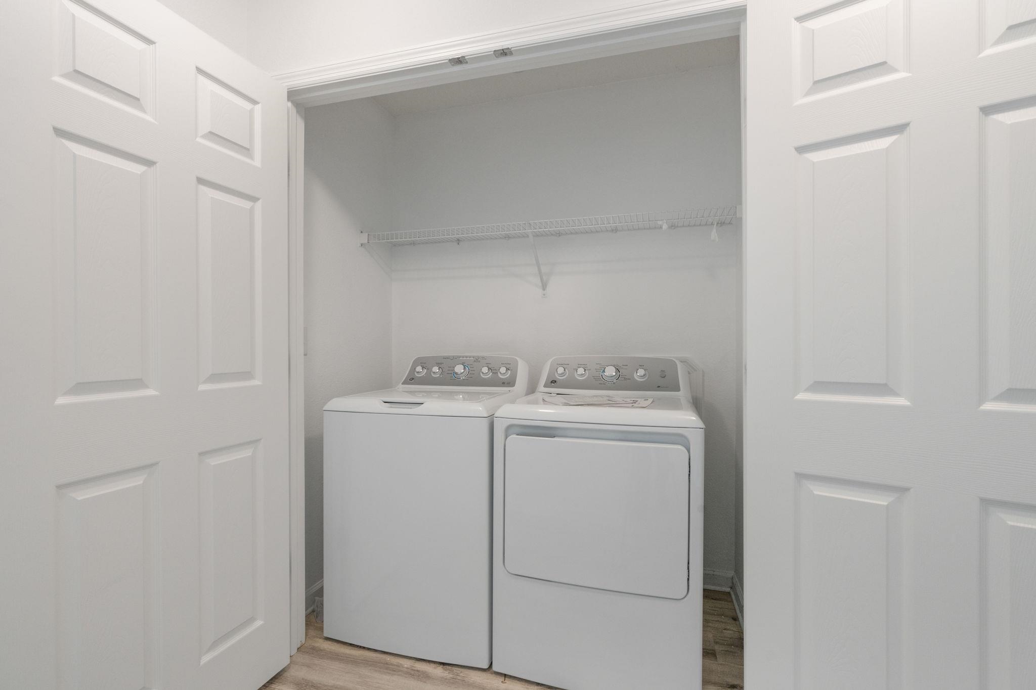 128 Islander Circle St. Augustine, FL 32080 - Photo 17 of 24 a utility room with dryer and washer