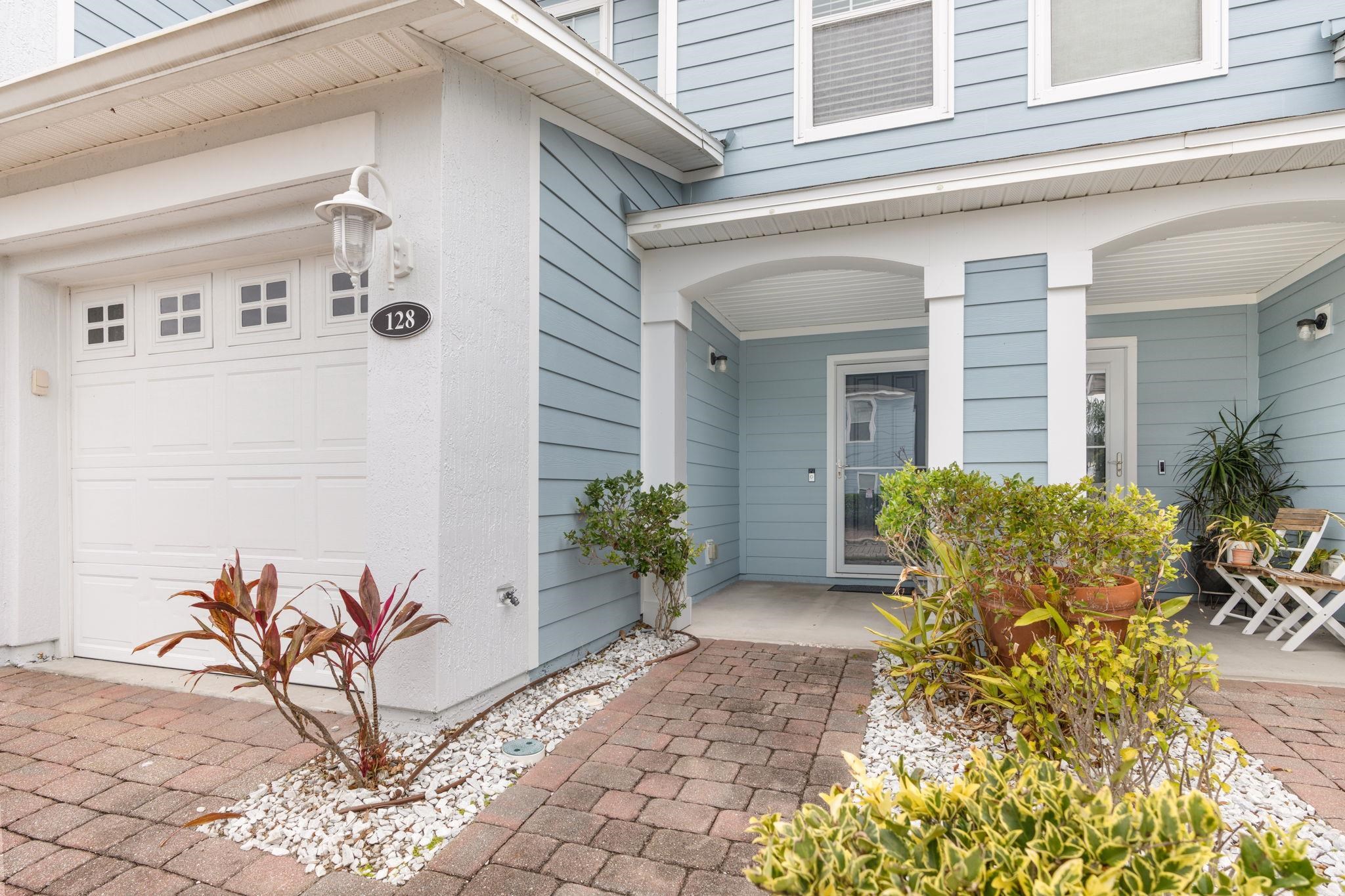 128 Islander Circle St. Augustine, FL 32080 - Photo 2 of 24 a view of a potted plants in front of a house