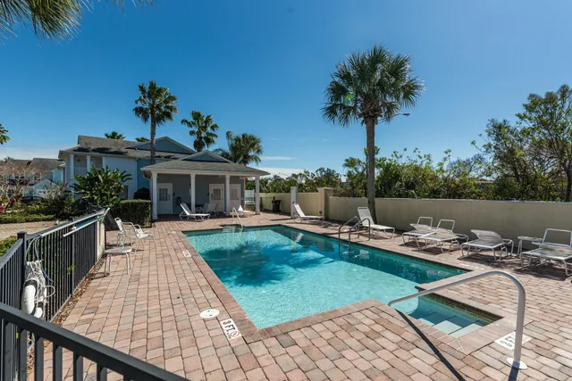 a view of a house with pool porch and wooden floor