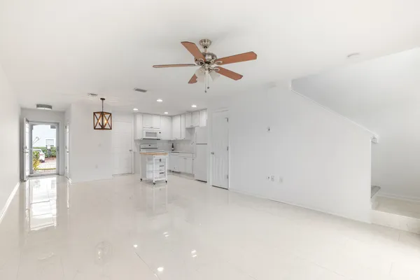 a view of an empty room with a window