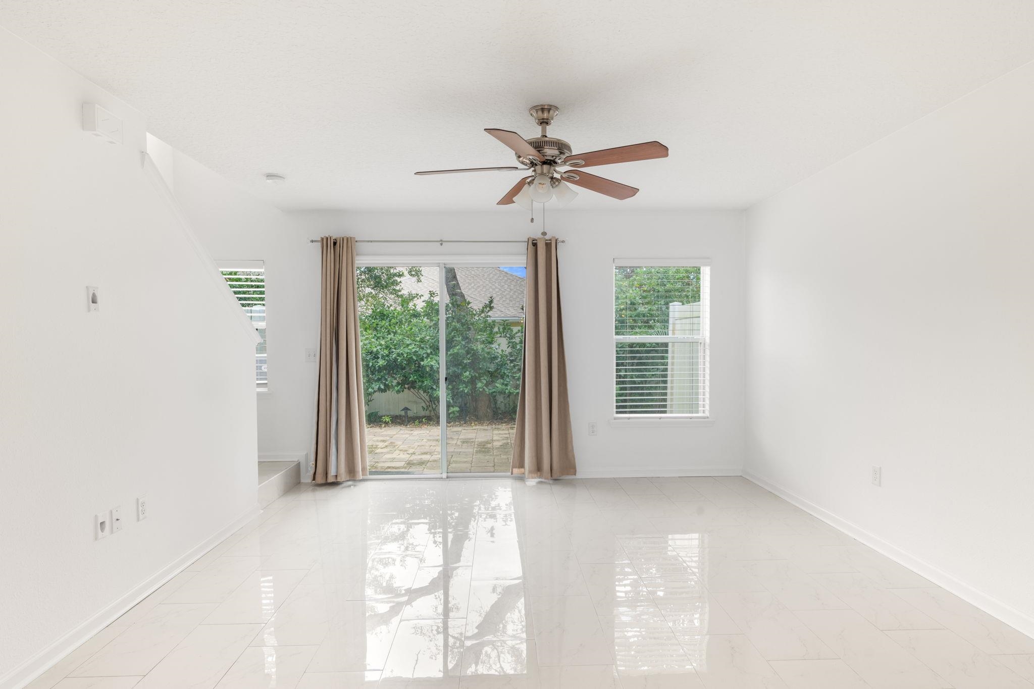 128 Islander Circle St. Augustine, FL 32080 - Photo 6 of 24 a view of room with balcony and ceiling fan