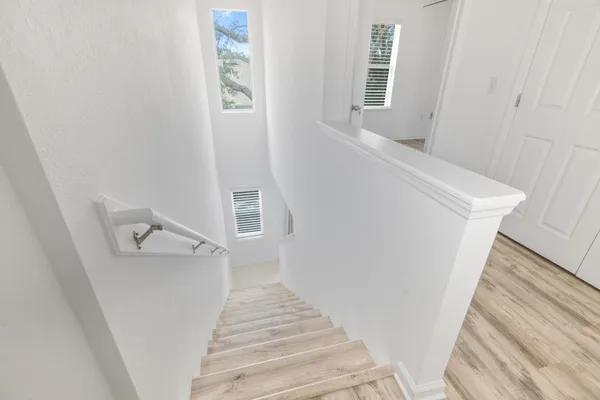 a view of a hallway with staircase