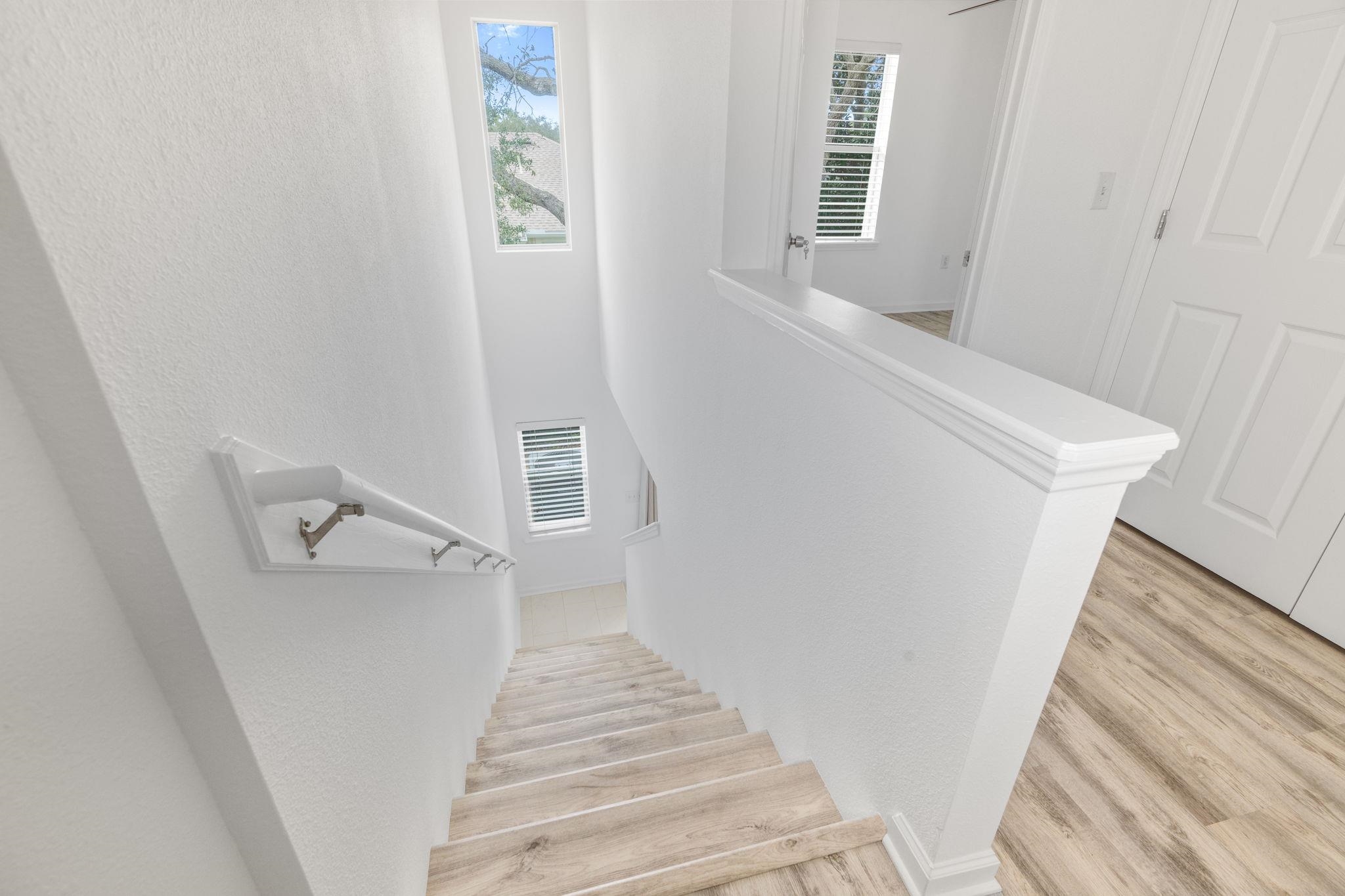 128 Islander Circle St. Augustine, FL 32080 - Photo 9 of 24 a view of a hallway with staircase