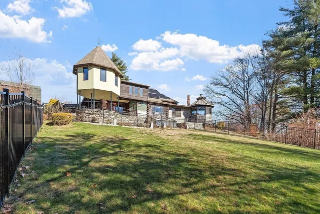 a tall building with trees in the background