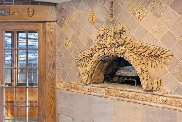 a living room with furniture a rug and a large window