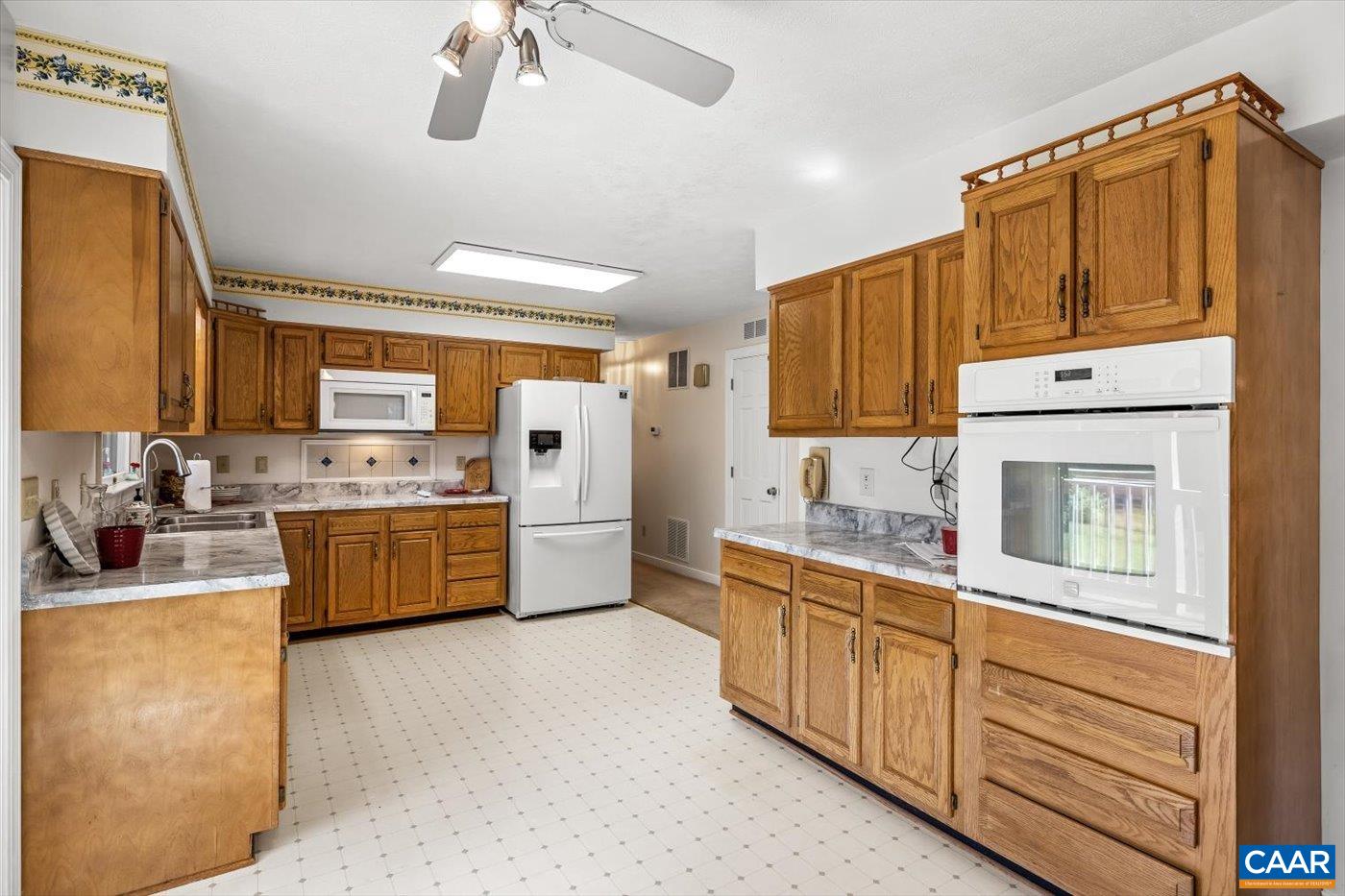 6134 Spring Hill Road Ruckersville, VA 22968 - Photo 29 of 54 a kitchen with a sink cabinets and window