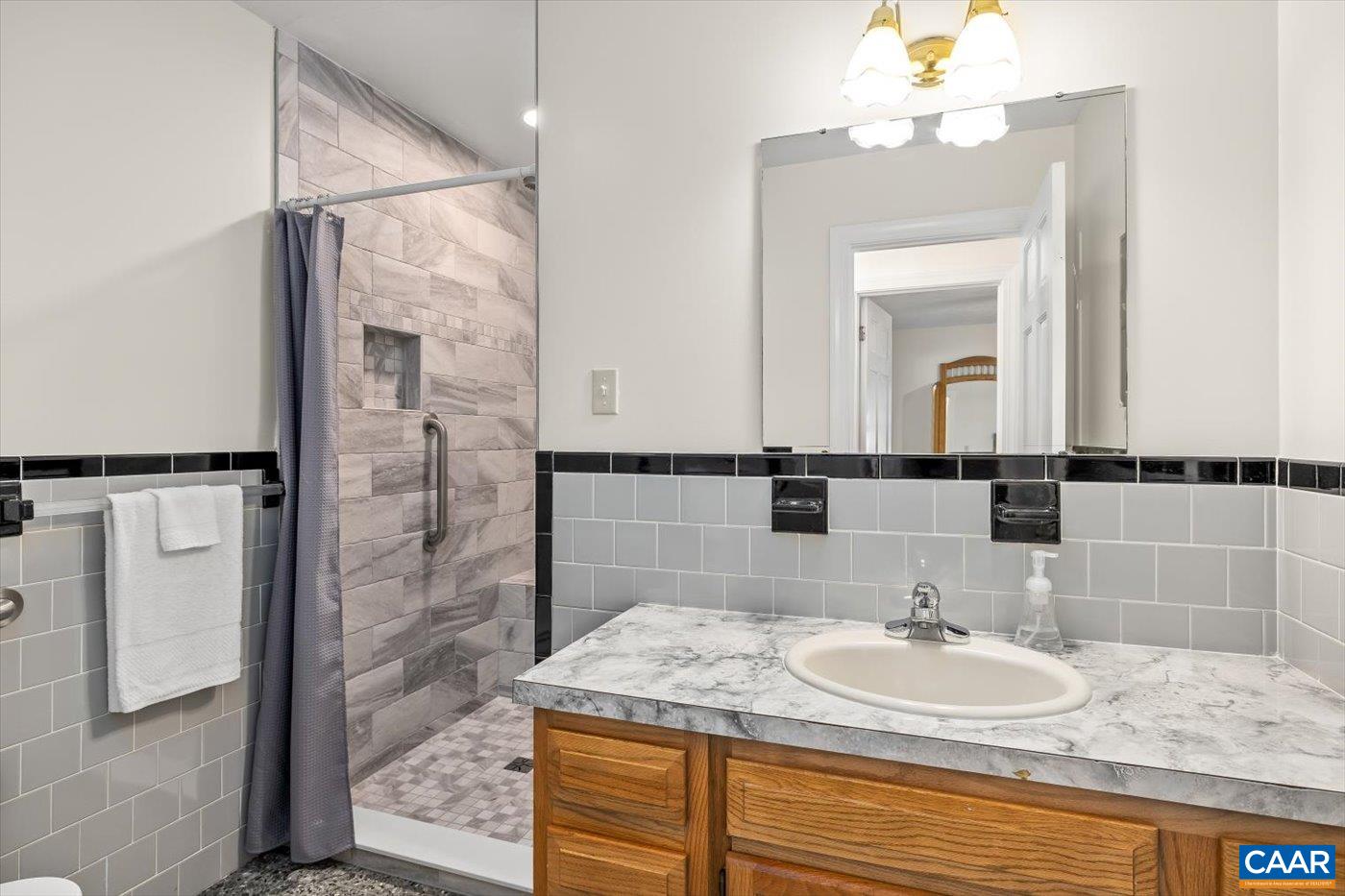 6134 Spring Hill Road Ruckersville, VA 22968 - Photo 33 of 54 a bathroom with a sink and a mirror