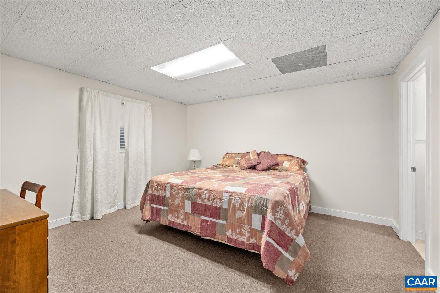 6134 Spring Hill Road Ruckersville, VA 22968 - Photo 42 of 54 a bedroom with a bed and a mirror