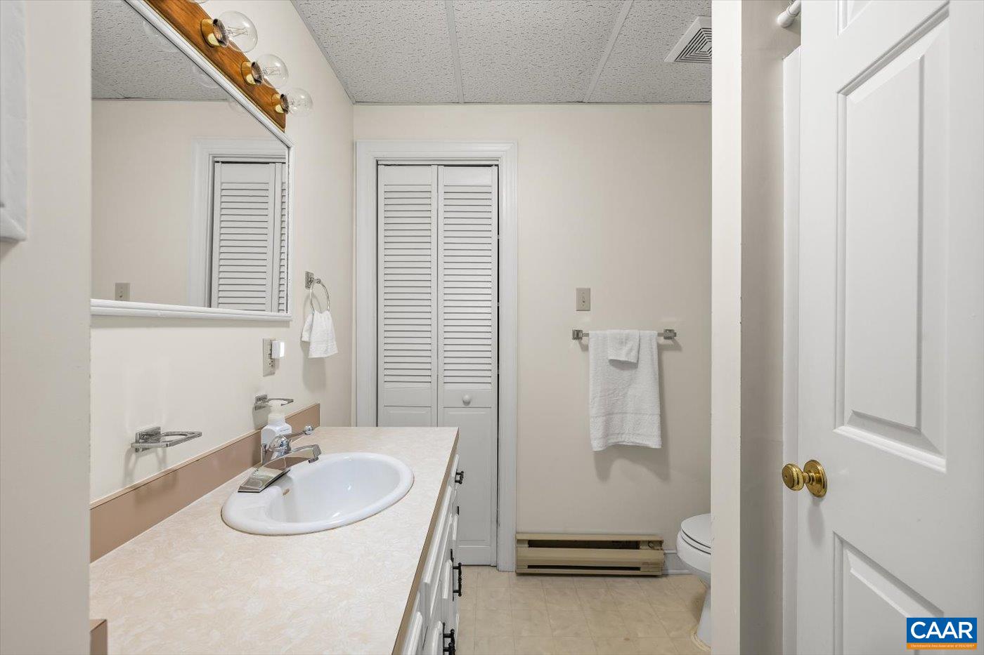 6134 Spring Hill Road Ruckersville, VA 22968 - Photo 43 of 54 a bathroom with a sink and a mirror