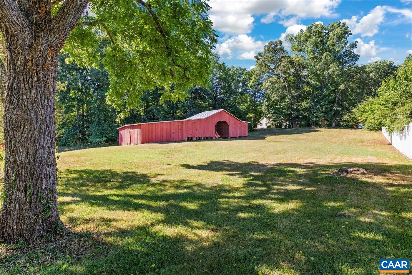 6134 Spring Hill Road Ruckersville, VA 22968 - Photo 6 of 54 a view of yard with swimming pool and trees in the background