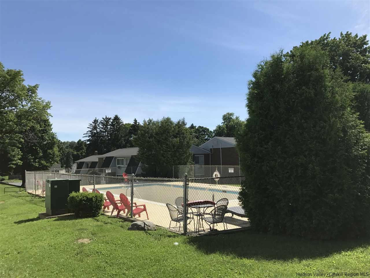 2740 South Road, Unit G7 Poughkeepsie, NY 12601 - Photo 2 of 12 a swimming pool with wooden fence