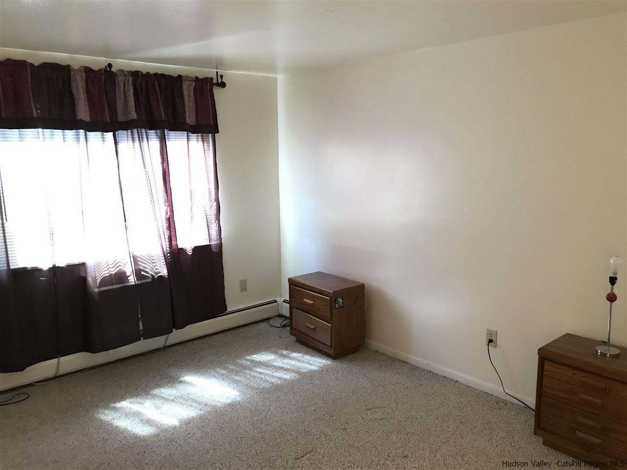 2740 South Road, Unit G7 Poughkeepsie, NY 12601 - Photo 3 of 12 a view of a closet with wooden floor and windows